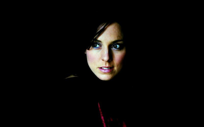 Woman in Dark Setting — Black, Dramatic, Photograph, Face, Eyes