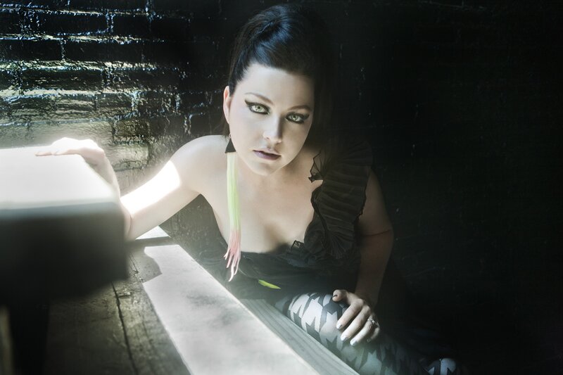 woman in dark setting with dramatic lighting