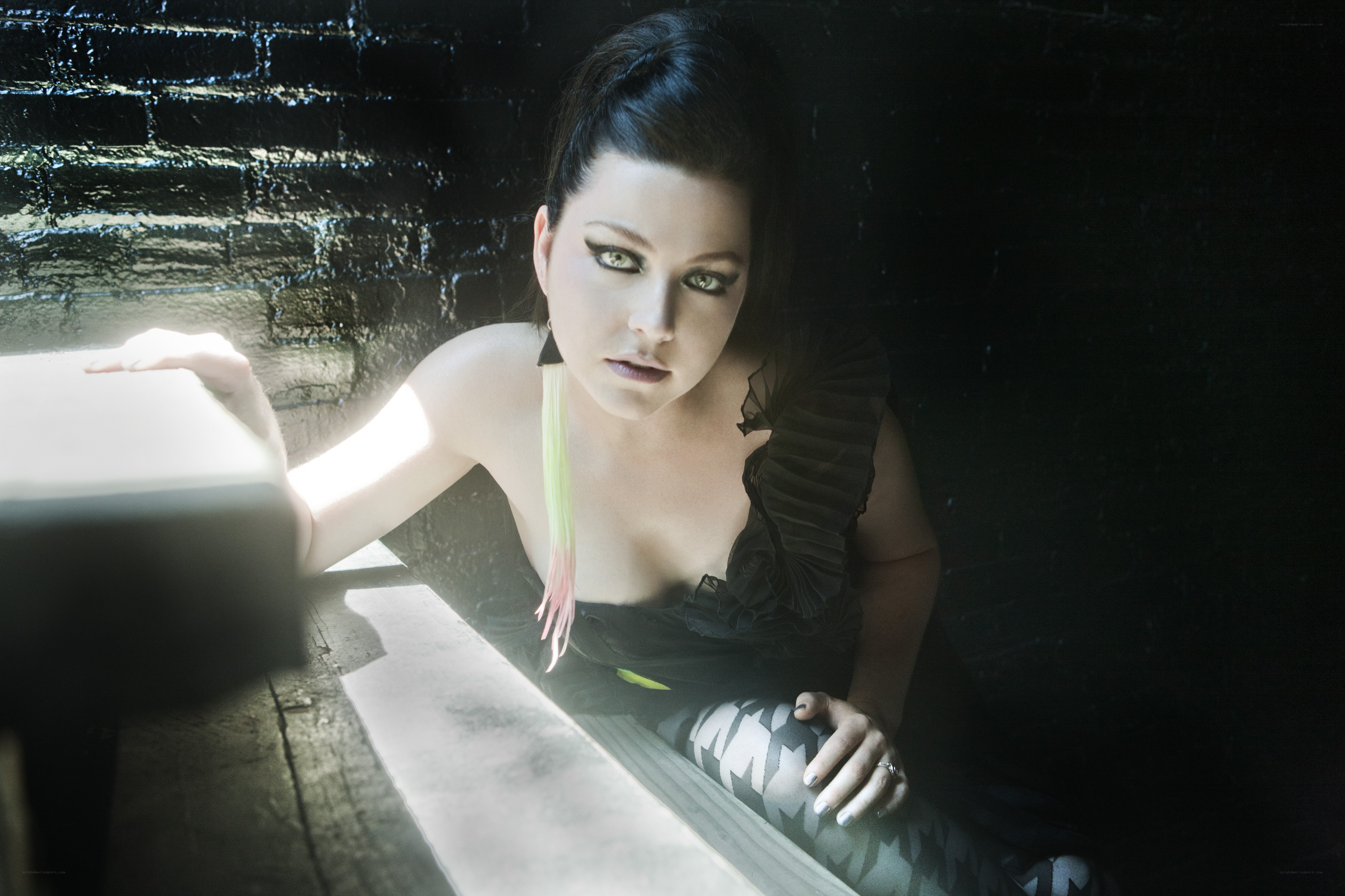 woman in dark setting with dramatic lighting