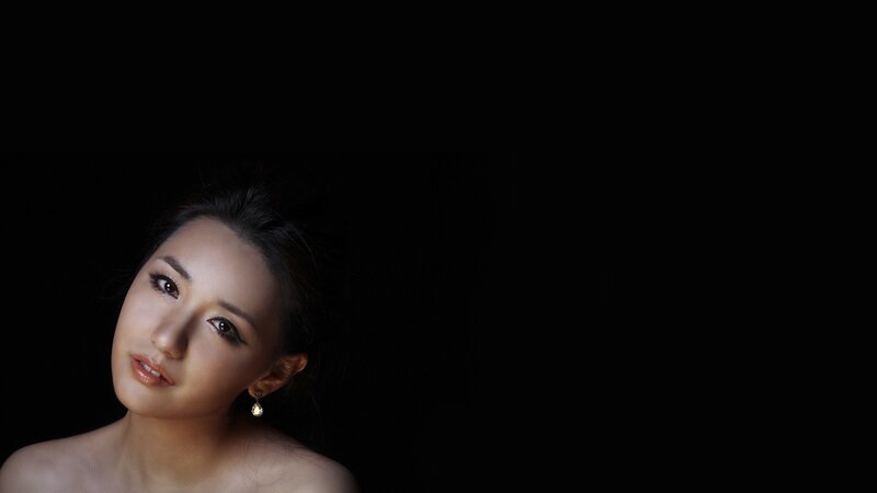 woman in dark studio portrait
