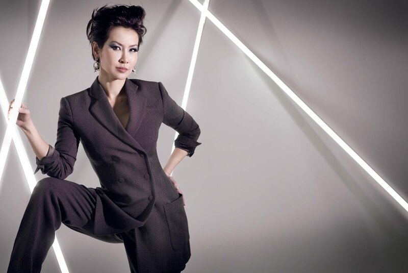 woman in dark suit posing