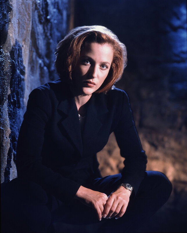 woman in dark suit sitting