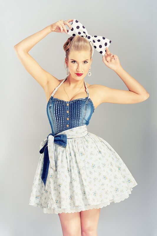 woman in denim and floral dress