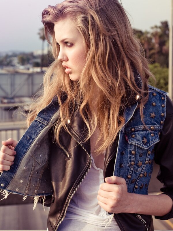 woman in denim and leather jacket