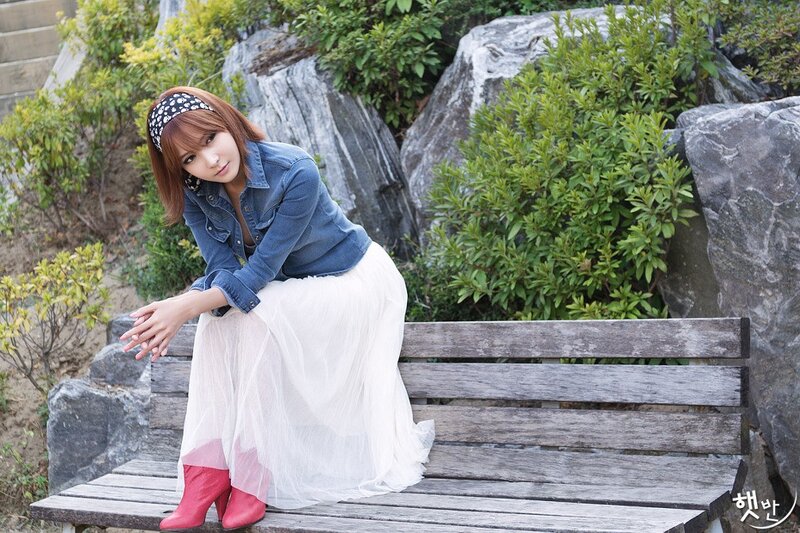 Woman in denim and white skirt