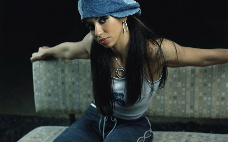 woman in denim hat and tank top