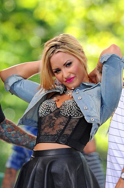 woman in denim jacket and lace top