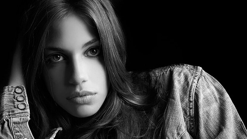 Woman in Denim Jacket — Black, Dramatic, Photograph