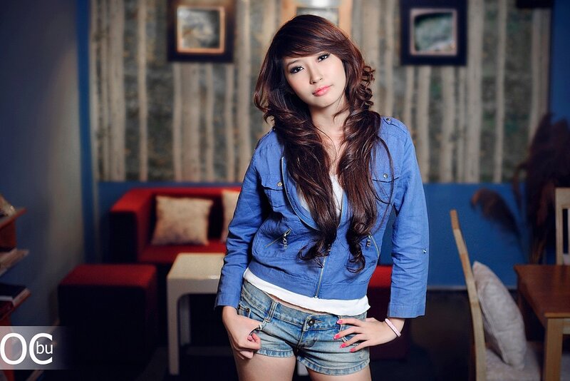 Woman in Denim Jacket — Blue, Neutral, Photograph, Couch