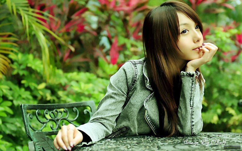 Woman in Denim Jacket — Green, Contemplative