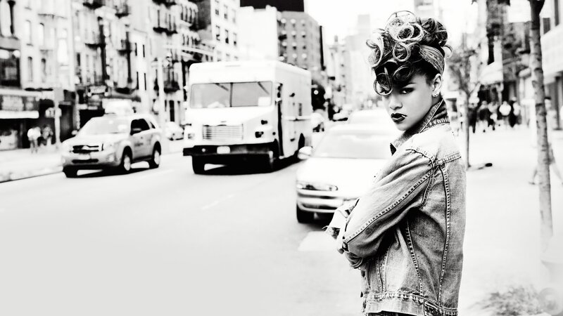 woman in denim jacket on city street