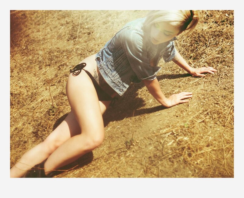 woman in denim jacket on ground