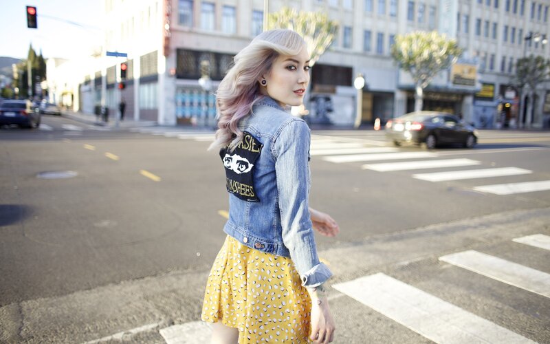 woman in denim jacket on street