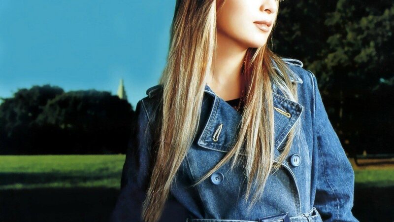 woman in denim jacket outdoors