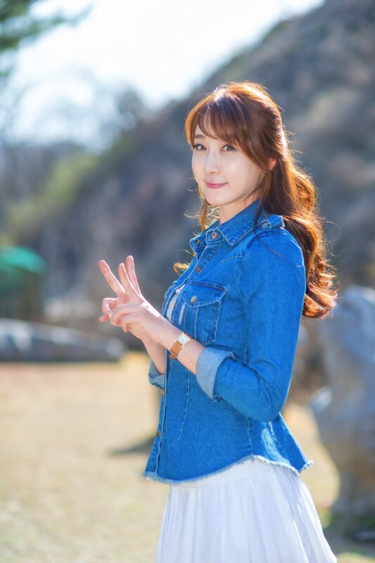 woman in denim jacket outdoors