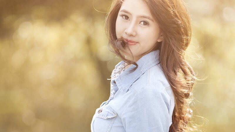 woman in denim jacket outdoors