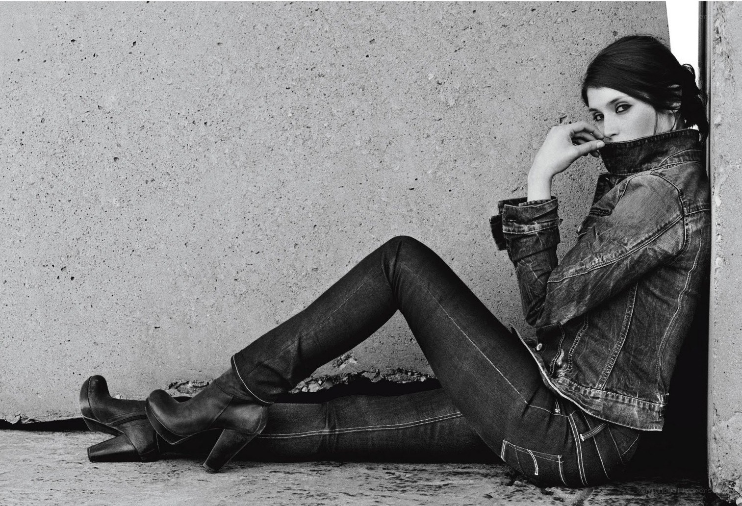 woman in denim jacket sitting