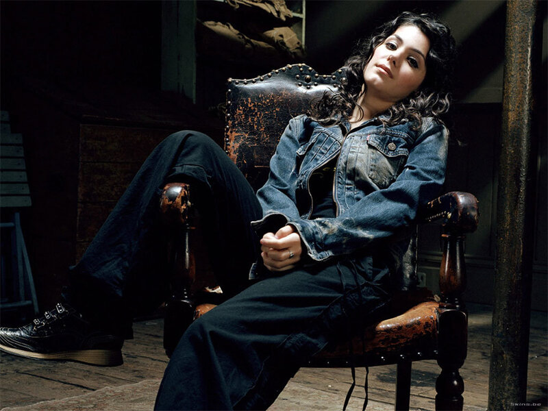woman in denim jacket sitting