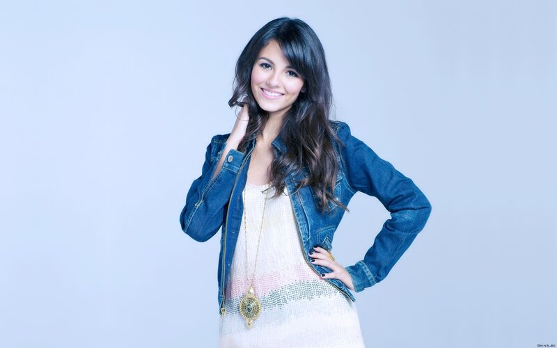 woman in denim jacket smiling