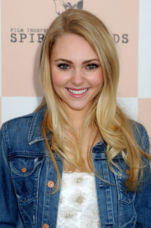 woman in denim jacket smiling