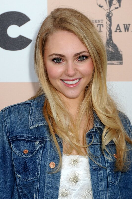 woman in denim jacket smiling