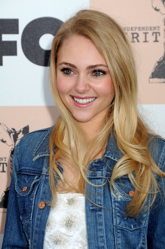 woman in denim jacket smiling