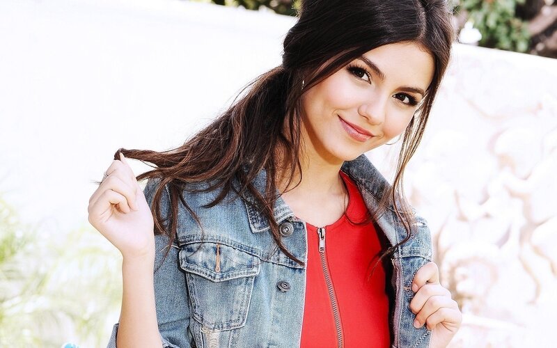 woman in denim jacket smiling