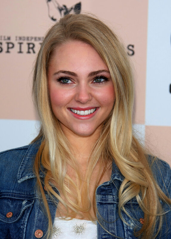woman in denim jacket smiling