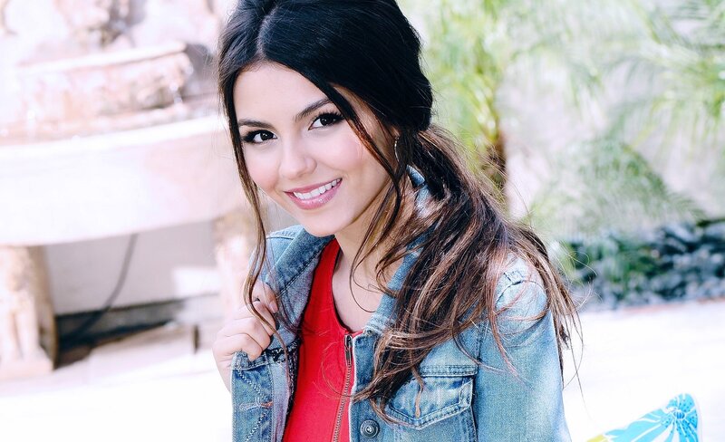 woman in denim jacket smiling
