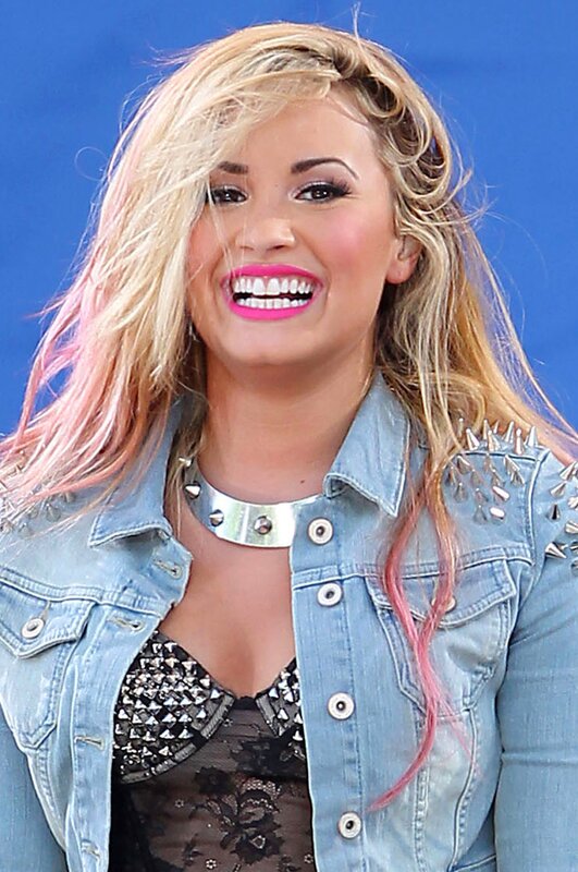 Woman in denim jacket smiling