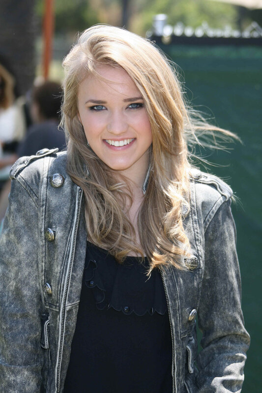 woman in denim jacket smiling