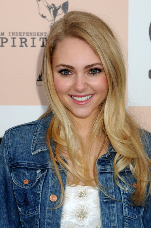 woman in denim jacket smiling