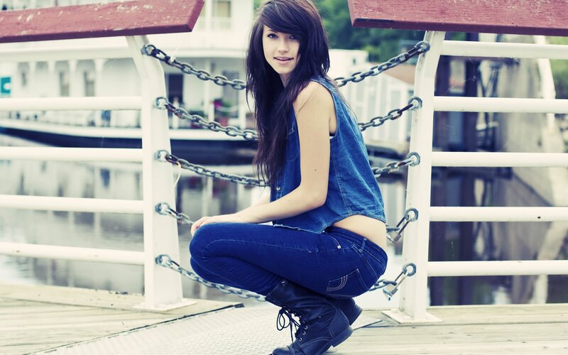 woman in denim on a dock