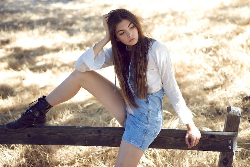woman in denim overalls