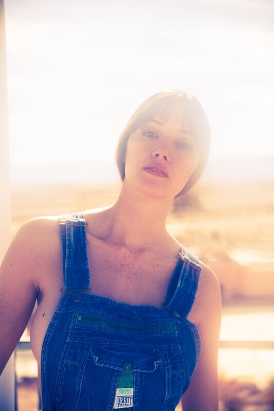 woman in denim overalls