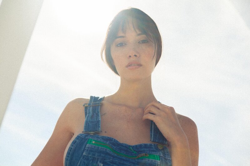 woman in denim overalls
