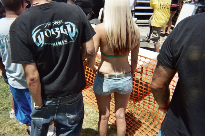 Woman in Denim Shorts — Black, Outdoor, Afternoon