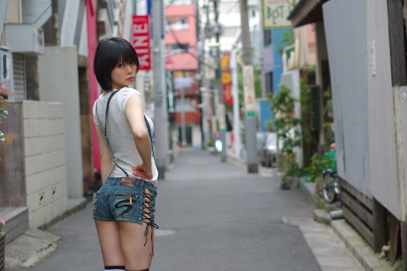 Woman in denim shorts on a street