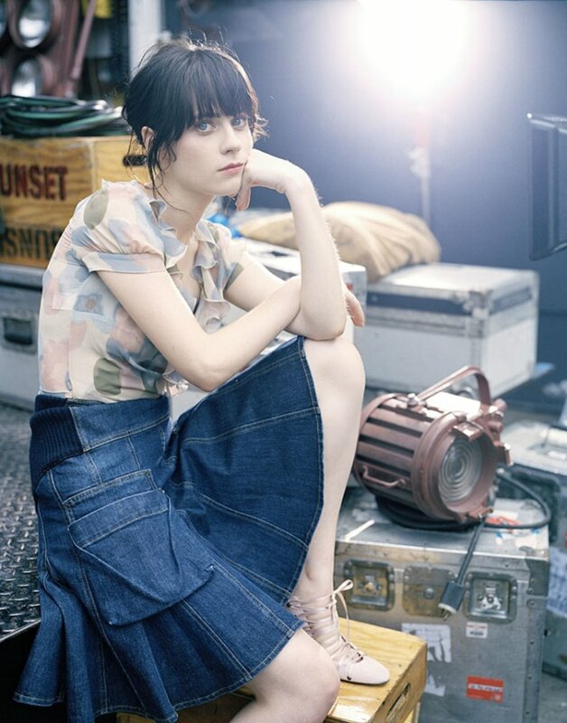 woman in denim skirt sitting