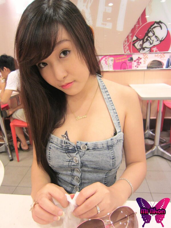 woman in denim top at fast food restaurant