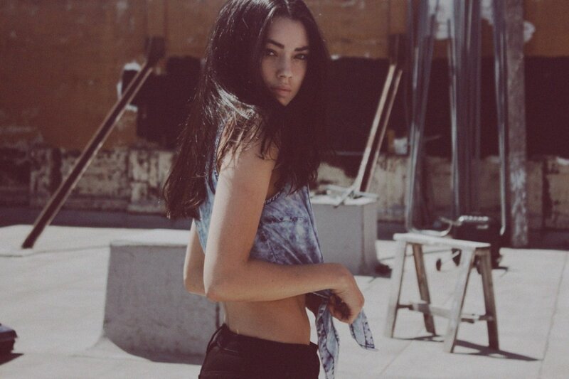 woman in denim top on rooftop
