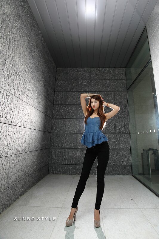 woman in denim top posing