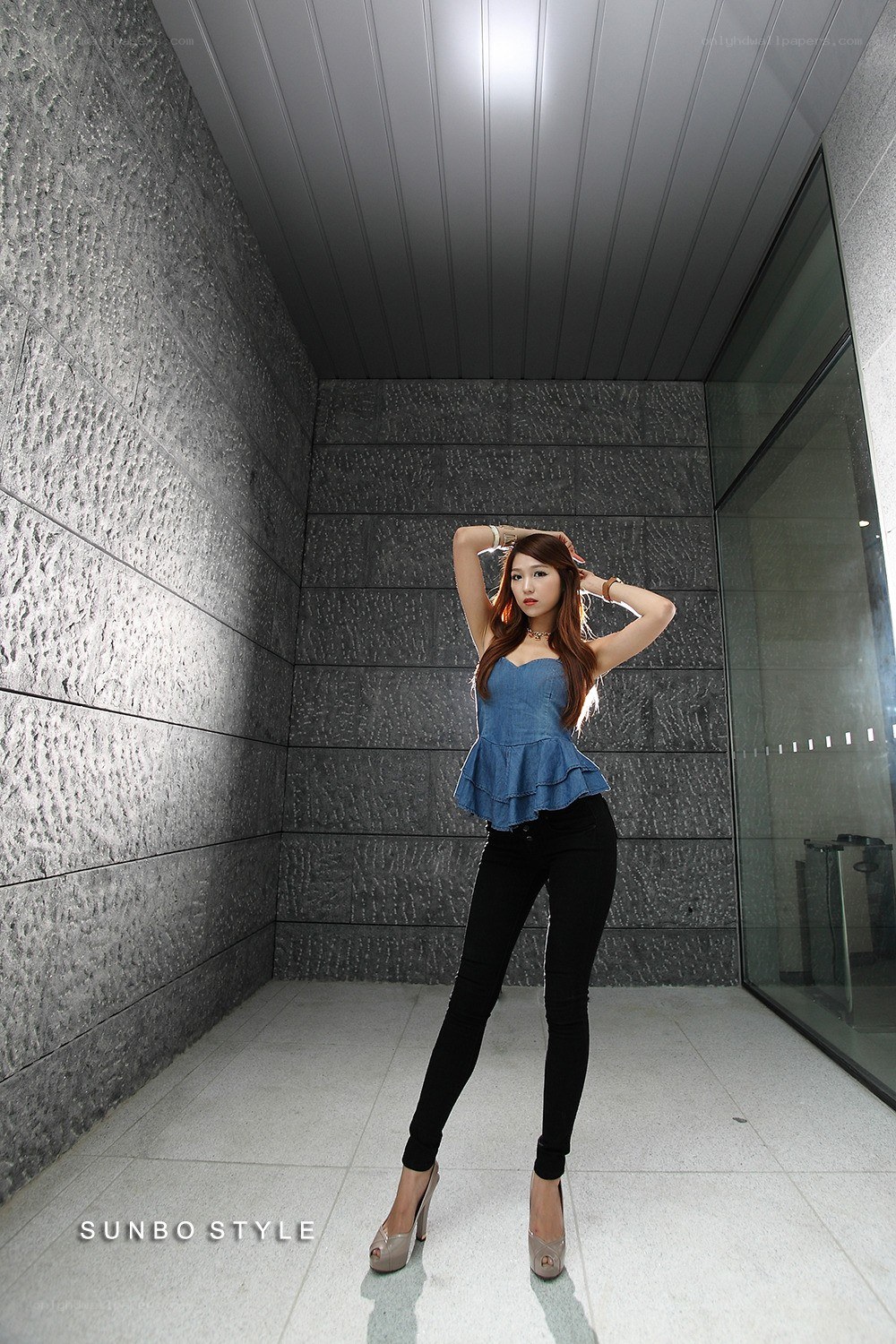 woman in denim top posing