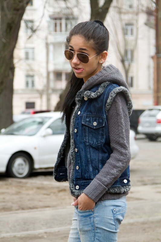 woman in denim vest