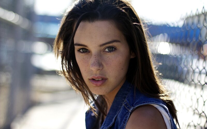 woman in denim vest