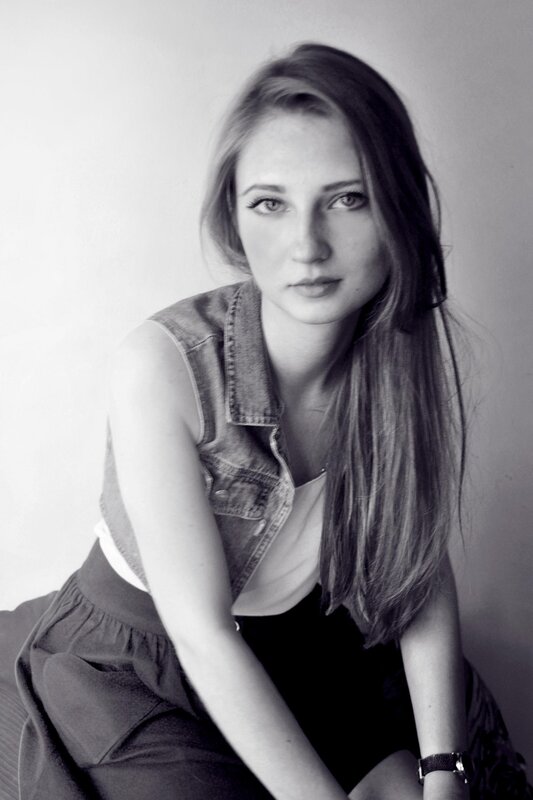 woman in denim vest