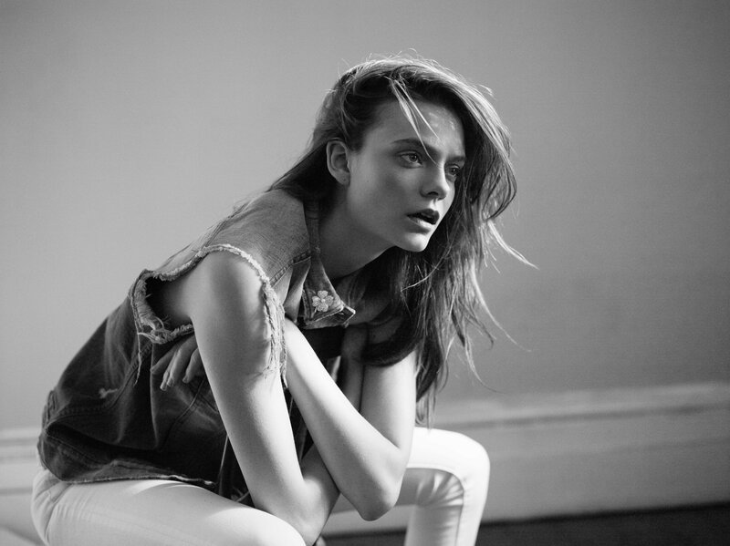woman in denim vest