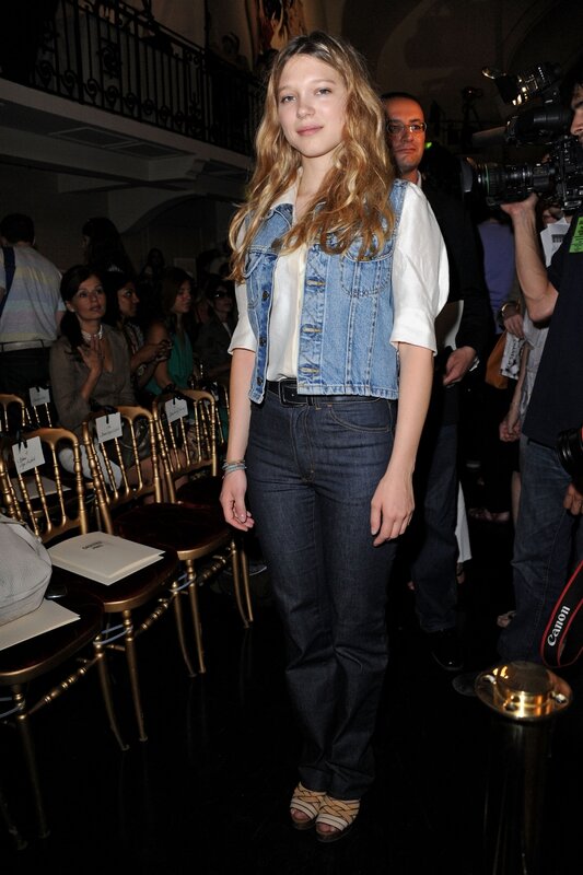 woman in denim vest at event