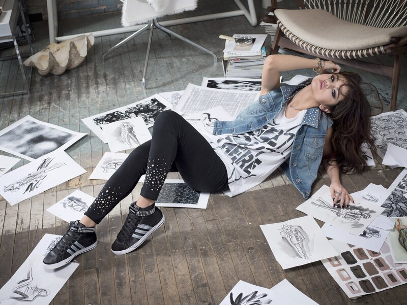 woman in denim vest on floor