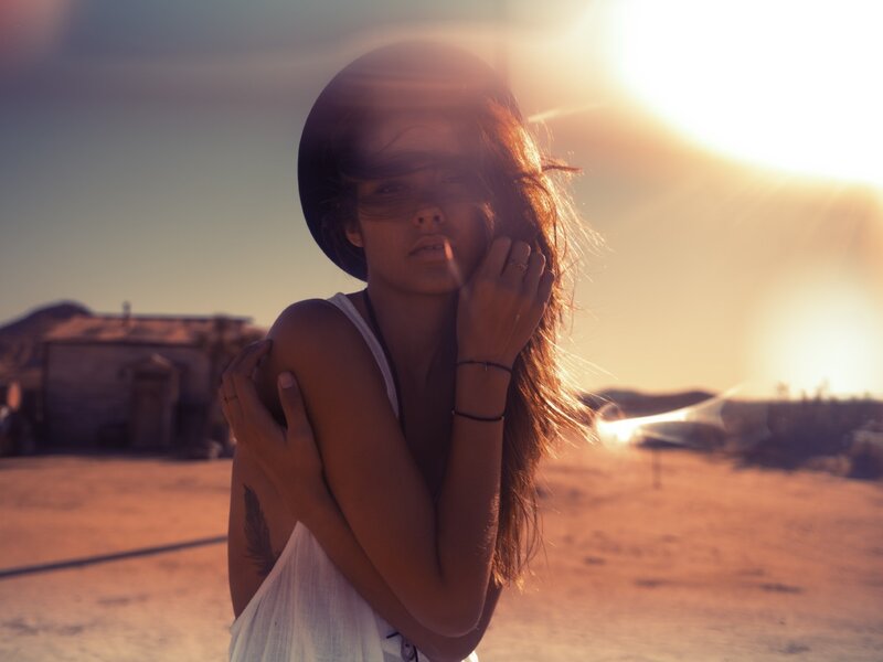 woman in desert at sunset